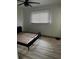 Inviting bedroom featuring a wood slat bed frame and vinyl wood flooring at 3230 Vanderbilt Nw Ln, Atlanta, GA 30318
