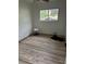Cozy room featuring vinyl wood flooring, and a window allowing lots of natural light at 3230 Vanderbilt Nw Ln, Atlanta, GA 30318