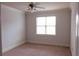 Bedroom with carpet, neutral walls, and a window with blinds at 2300 Peachford Rd # 1209, Atlanta, GA 30338