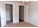 Spacious bedroom with carpet, neutral walls, and ample closet space at 2300 Peachford Rd # 1209, Atlanta, GA 30338