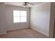 Bright bedroom with carpet, neutral walls, and a window with blinds at 2300 Peachford Rd # 1209, Atlanta, GA 30338