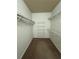 Walk-in closet with metal shelving, offering plenty of storage space at 2300 Peachford Rd # 1209, Atlanta, GA 30338