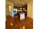 Open kitchen features an island, stainless appliances, and hardwood flooring at 2300 Peachford Rd # 1209, Atlanta, GA 30338