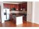 Kitchen with granite island, stainless steel appliances, and wood cabinets at 2300 Peachford Rd # 1209, Atlanta, GA 30338