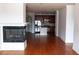 Living room with hardwood floors and view into kitchen area at 2300 Peachford Rd # 1209, Atlanta, GA 30338