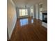 Living room with hardwood floors, natural light, fireplace, and fan at 2300 Peachford Rd # 1209, Atlanta, GA 30338