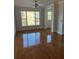 Living room with hardwood floors, natural light and fan at 2300 Peachford Rd # 1209, Atlanta, GA 30338