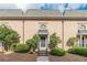 Brick townhouse with a gray roof and landscaping at 6980 Roswell Rd # J6, Atlanta, GA 30328