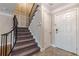 Modern staircase with gray carpeting and black railing at 6980 Roswell Rd # J6, Atlanta, GA 30328