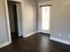 Bedroom with hardwood floors and a door leading to the outside at 148 Murray Hill Ne Ave, Atlanta, GA 30317