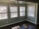 Bright sunroom with multiple windows providing natural light, and hardwood floors at 148 Murray Hill Ne Ave, Atlanta, GA 30317