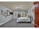 Bright bedroom with gray carpet and access to the backyard at 1035 Dorris Rd, Douglasville, GA 30134