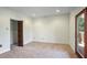 Spacious basement room with carpeting, door to closet, and sliding glass door to deck at 1801 Laurel Creek Se Trl, Smyrna, GA 30080