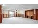 Finished basement with wood paneling and access to outdoors at 1801 Laurel Creek Se Trl, Smyrna, GA 30080