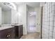 Double vanity bathroom with shower and access to bedroom at 1801 Laurel Creek Se Trl, Smyrna, GA 30080