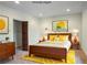 Bedroom with vintage furniture and sunny yellow rug at 1801 Laurel Creek Se Trl, Smyrna, GA 30080