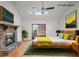 Bright bedroom with stone fireplace, skylight, and sliding door access to deck at 1801 Laurel Creek Se Trl, Smyrna, GA 30080
