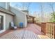 Wooden deck with seating area and access to a screened porch at 1801 Laurel Creek Se Trl, Smyrna, GA 30080