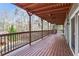 Long wooden deck with wooden railings overlooking a wooded area at 1801 Laurel Creek Se Trl, Smyrna, GA 30080