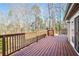 Wooden deck with access from sliding glass door, offering backyard views at 1801 Laurel Creek Se Trl, Smyrna, GA 30080