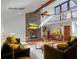 This living room offers a stone fireplace, ceiling fan and a loft area above at 1801 Laurel Creek Se Trl, Smyrna, GA 30080