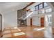 Vaulted ceiling living room with hardwood floors and stone fireplace at 1801 Laurel Creek Se Trl, Smyrna, GA 30080