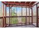 Screened porch with wooden frame offering backyard views at 1801 Laurel Creek Se Trl, Smyrna, GA 30080