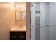 Bathroom featuring shower with glass doors, with modern vanity and finishes at 589 Northern Ave, Clarkston, GA 30021