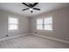 Bright bedroom with two windows, ceiling fan and modern flooring at 589 Northern Ave, Clarkston, GA 30021