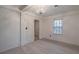 Bright bedroom with wood floor, white walls, and stylish chandelier at 589 Northern Ave, Clarkston, GA 30021
