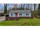 Charming home with a red front door and a well-maintained lawn at 589 Northern Ave, Clarkston, GA 30021