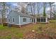 Back view of the home featuring a sunroom with lots of natural light at 589 Northern Ave, Clarkston, GA 30021