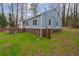 Side view of home with mature trees, showcasing the well-manicured lawn at 589 Northern Ave, Clarkston, GA 30021