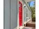 Close-up of a bright red front door, adding a pop of color to the exterior at 589 Northern Ave, Clarkston, GA 30021