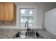 Modern kitchen sink and countertops with a view to the outdoor at 589 Northern Ave, Clarkston, GA 30021