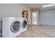Modern laundry area in sunroom, featuring new washer and dryer units at 589 Northern Ave, Clarkston, GA 30021