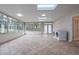 Bright sunroom featuring tile floors, large windows, and convenient laundry area at 589 Northern Ave, Clarkston, GA 30021