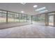 Large sunroom filled with natural light, featuring tile floors and access to the outdoors at 589 Northern Ave, Clarkston, GA 30021