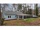 Home exterior with sunroom featuring large windows and natural light at 589 Northern Ave, Clarkston, GA 30021