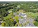 Aerial view of community clubhouse, golf course, and landscape at 6202 Talmadge Nw Way, Acworth, GA 30101