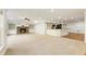 Finished basement with a large open area, fireplace, and kitchen at 6202 Talmadge Nw Way, Acworth, GA 30101