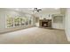 Finished basement with a fireplace and built-in shelving at 6202 Talmadge Nw Way, Acworth, GA 30101