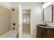 Bathroom with shower, bathtub, and vanity at 6202 Talmadge Nw Way, Acworth, GA 30101