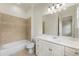 Clean bathroom with a white vanity, bathtub, and tiled shower at 6202 Talmadge Nw Way, Acworth, GA 30101