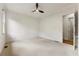 Bright and spacious bedroom with ceiling fan and neutral carpeting at 6202 Talmadge Nw Way, Acworth, GA 30101