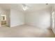 Large bedroom with ceiling fan and access to a bathroom at 6202 Talmadge Nw Way, Acworth, GA 30101