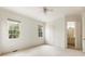 Well-lit bedroom with two windows and carpeting at 6202 Talmadge Nw Way, Acworth, GA 30101