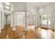 Bright and airy entrance with hardwood floors and columns at 6202 Talmadge Nw Way, Acworth, GA 30101