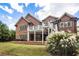 Brick house with large deck and landscaping at 6202 Talmadge Nw Way, Acworth, GA 30101