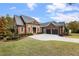 Brick home with a three-car garage and landscaped lawn at 6202 Talmadge Nw Way, Acworth, GA 30101